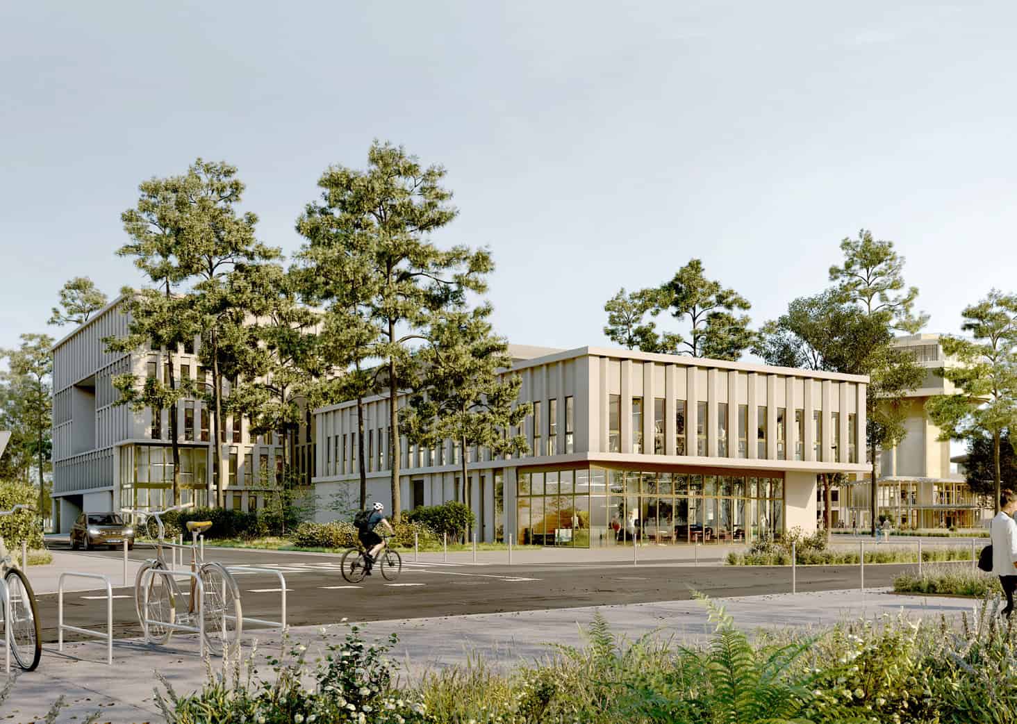 Vue d'ensemble d'un bâtiment moderne et écologique à Urb1n, entouré d'arbres et d'espaces verts.
