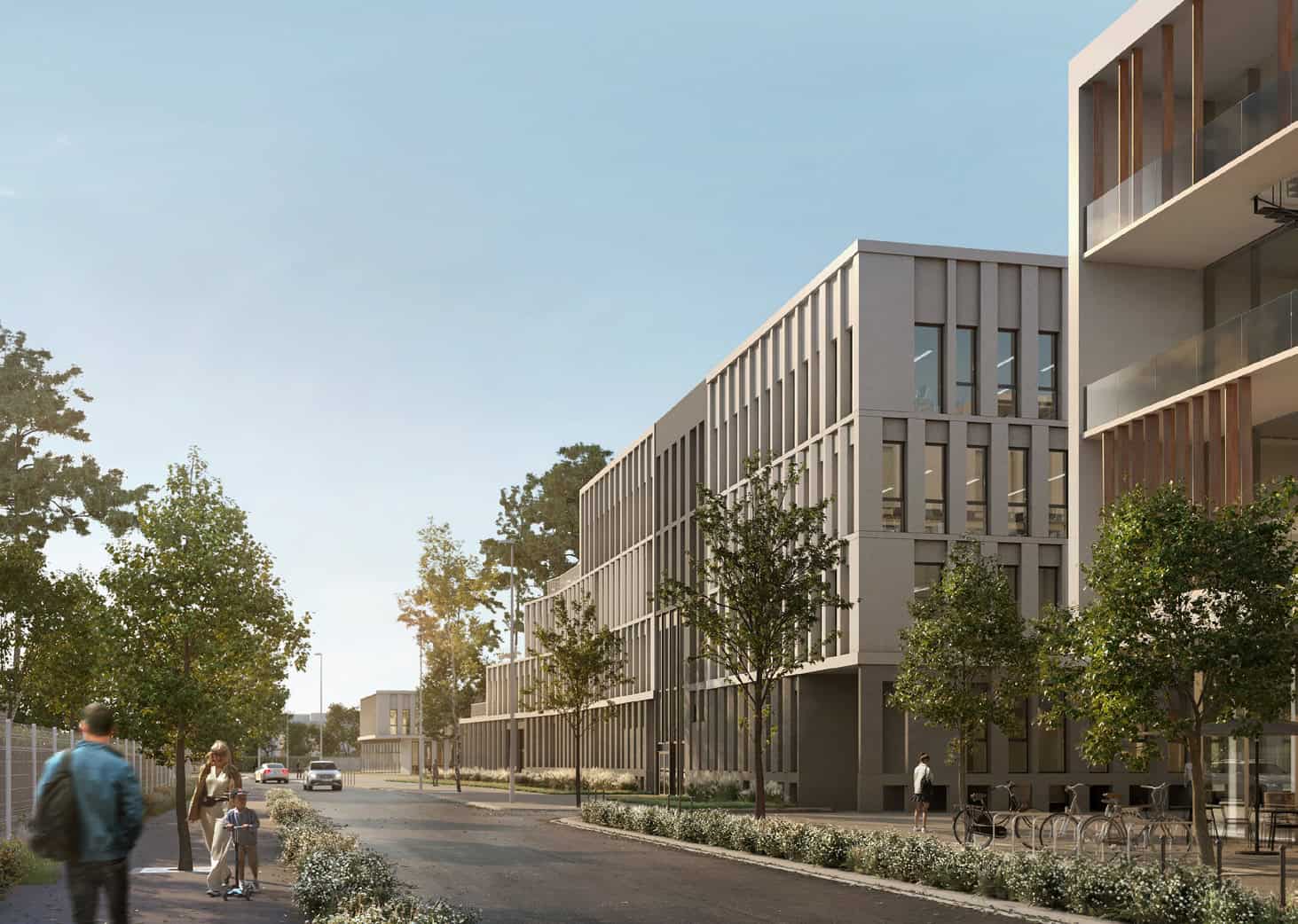 Vue d'ensemble de bâtiments modernes et d'une rue animée en milieu urbain.